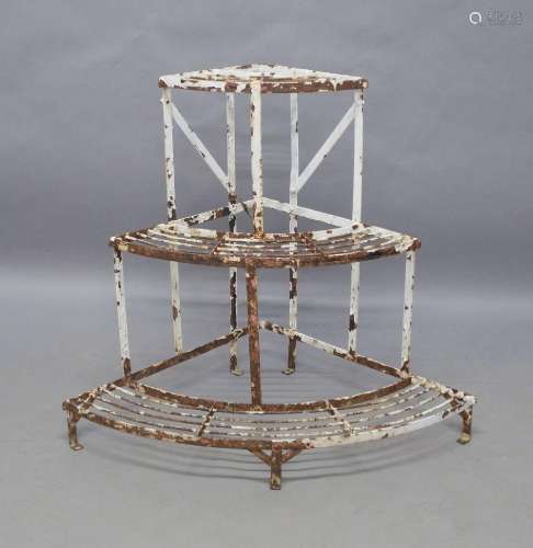 Two wrought iron three tier plant stands, 20th century, larg...
