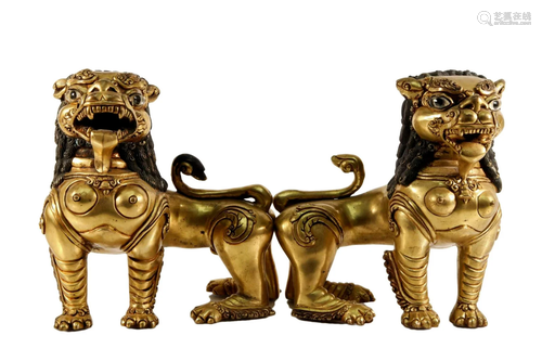 A Pair of Gilt Bronze Lion Ornaments