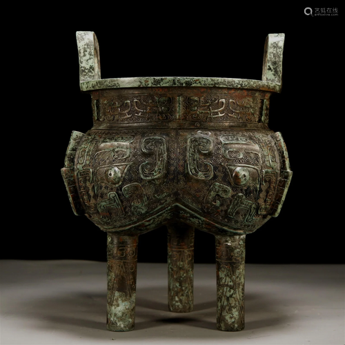 An Ancient Bronze Tripod 'Animal Mask' Ritual Food...