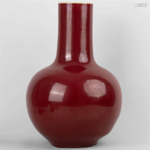 A red-glazed celestial ball vase with 'Yongzheng Nian Z...
