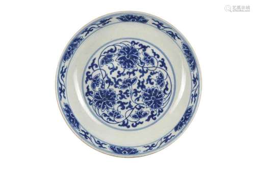 A CHINESE BLUE AND WHITE 'LOTUS SCROLL' DISH. Well with a ro...