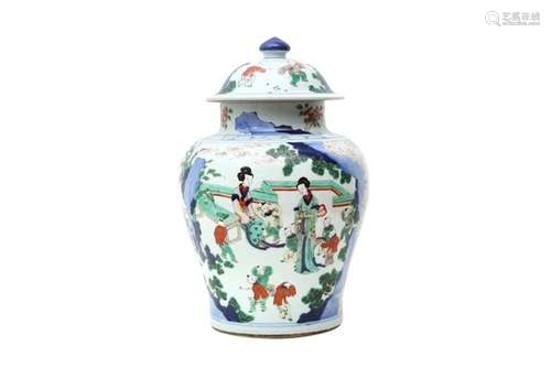 A CHINESE WUCAI 'LADIES AND BOYS' JAR AND COVER. The baluste...