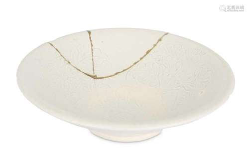 A CHINESE CREAM-GLAZED BOWL. With a flared body decorated wi...