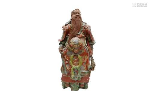 A JAPANESE GLAZED POTTERY FIGURE OF SHŌKI. Standing