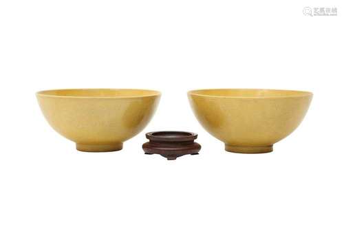 A PAIR OF CHINESE YELLOW-GLAZED 'DRAGON' BOWLS. Each bowl wi...