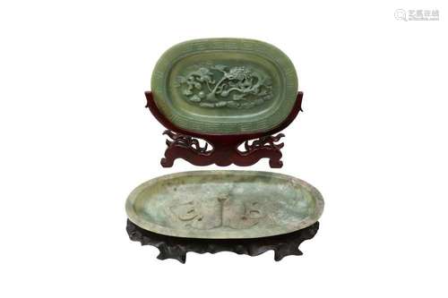 TWO CHINESE PALE CELADON JADE OVAL DISHES. One dish carved i...