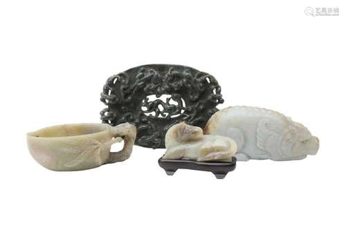 FOUR CHINESE JADE CARVINGS. Comprising a pale celadon jade c...