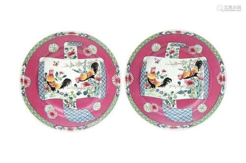 A PAIR OF CHINESE FAMILLE ROSE RUBY-GROUND 'COCKERELS' DISHE...