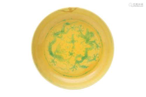 A CHINESE GREEN AND YELLOW-GLAZED 'DRAGON' DISH. Incised to ...