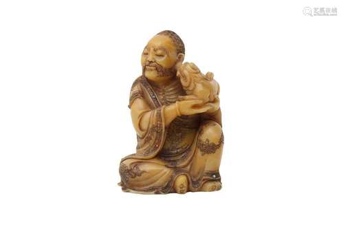 A CHINESE SOAPSTONE CARVING OF A LUOHAN