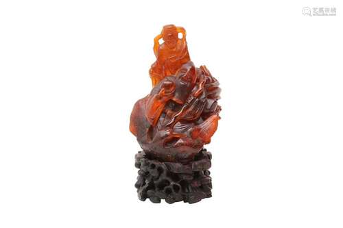 A CHINESE AMBER 'IMMORTALS' CARVING