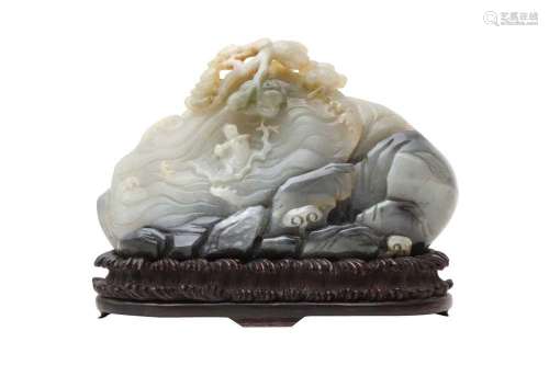 A CHINESE PALE CELADON AND GREY JADE 'MOUNTAIN' CARVING