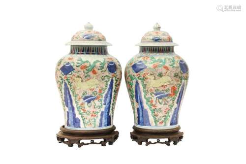 A NEAR-PAIR OF CHINESE WUCAI BALUSTER 'HORSES' VASES AND COV...