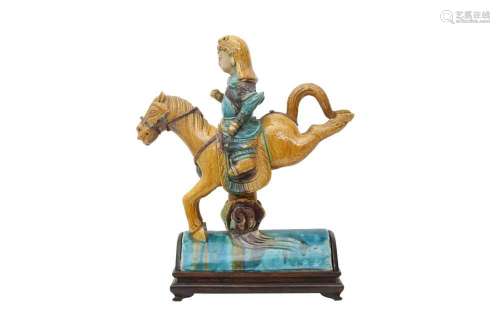 A CHINESE POLYCHROME-GLAZED 'HORSE AND RIDER' ROOF TILE