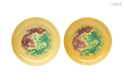 A PAIR OF CHINESE YELLOW-GROUND 'DRAGON' SAUCER DISHES