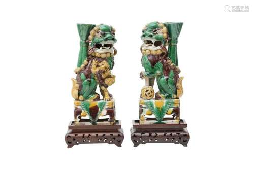 A PAIR OF CHINESE SANCAI-GLAZED LION DOGS