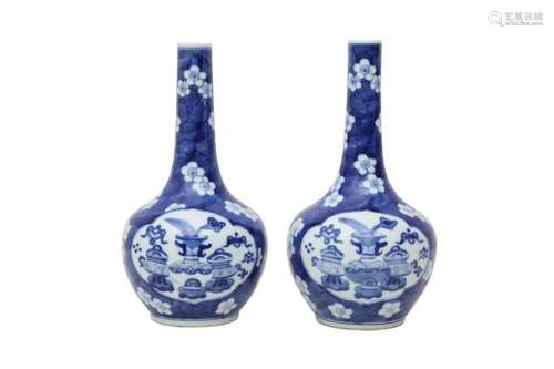 A PAIR OF CHINESE BLUE AND WHITE 'TREASURES' BOTTLE VASES