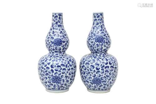 A PAIR OF CHINESE BLUE AND WHITE DOUBLE GOURD 'LOTUS SCROLL'...