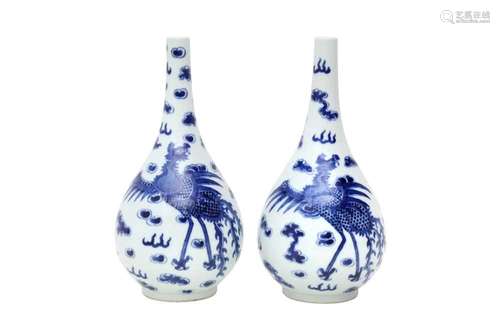 A PAIR OF CHINESE BLUE AND WHITE 'DRAGON AND PHOENIX' VASES