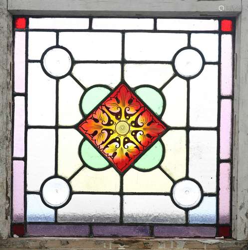 A LEADED STAINED GLASS WINDOW