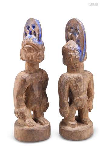 A PAIR OF NIGERIAN YORUBA `ERE IBEJI` TWIN MALE CARVED WOODE...