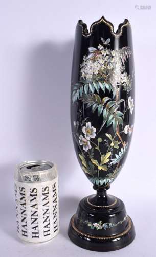 A VICTORIAN BLACK OPALINE GLASS VASE enamelled with flowers....