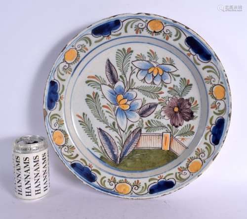 A LARGE 18TH DELFT FAIENCE CIRCULAR TIN GLAZED CHARGER paint...