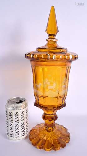 A LARGE LIDDED BOHEMIAN ETCHED AMBER GLASS VASE etched panel...