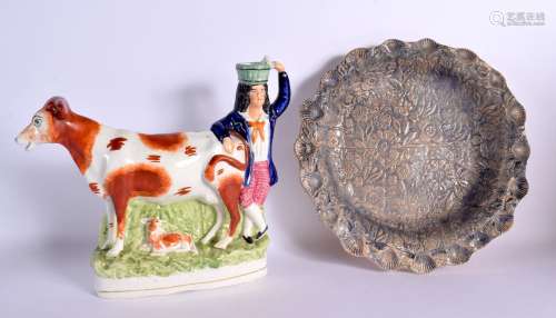 A LARGE ANTIQUE STAFFORDSHIRE FIGURE OF A COW together with ...