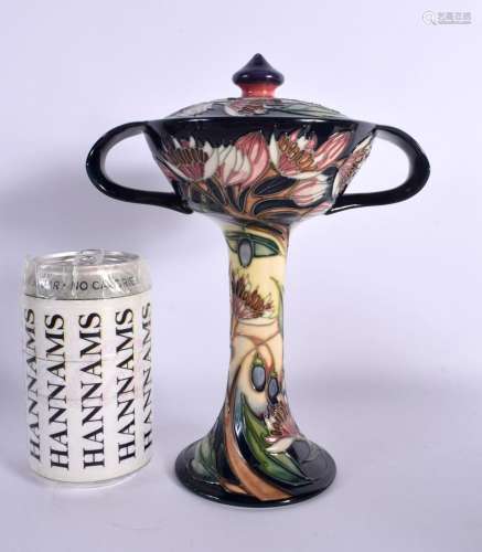 A LARGE MOORCROFT COLLECTORS CLUB TWIN HANDLED VASE AND COVE...