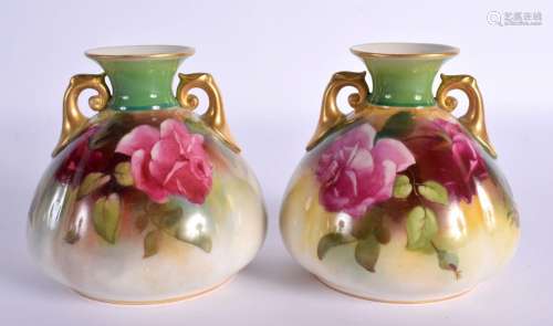 A PAIR OF ROYAL WORCESTER TWIN HANDLED VASES. 9 cm x 7 cm.