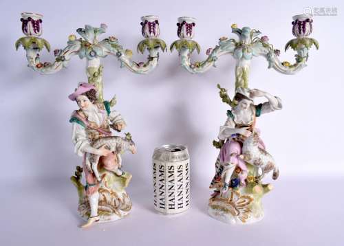 A PAIR OF 19TH CENTURY AUGUSTUS REX PORCELAIN FIGURAL CANDLE...