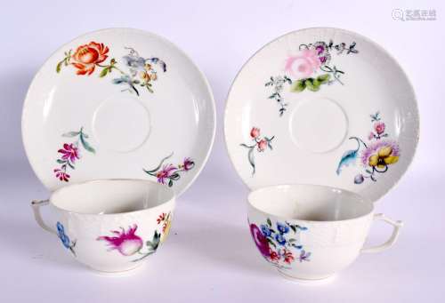18th c. Berlin teacups and saucers, painted with colourful f...