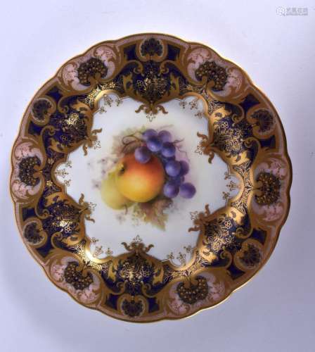 Royal Worcester plate painted with fruit under a blue and gi...