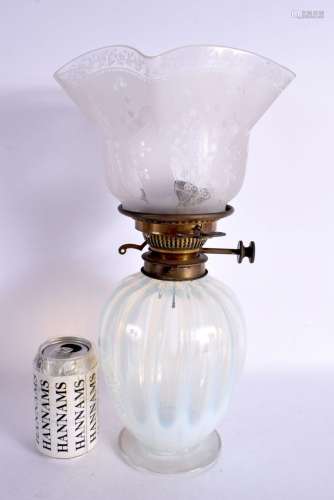 AN ANTIQUE VASELINE LAMP. 40 cm high.