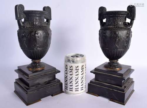 A PAIR OF 19TH CENTURY EUROPEAN GRAND TOUR BRONZE URNS upon ...