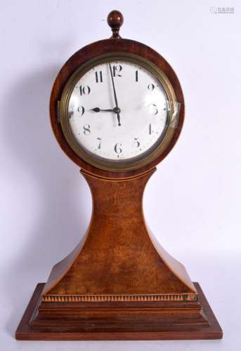 AN EDWARDIAN MAHOGANY MANTEL CLOCK. 35 cm 14 cm.