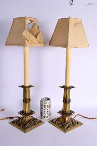 A LARGE PAIR OF LATE 19TH CENTURY BRASS CANDLESTICK LAMPS de...