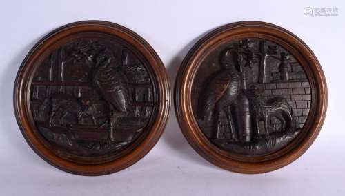 A PAIR OF LATE 19TH CENTURY BAVARIAN BLACK FOREST CARVED WOO...