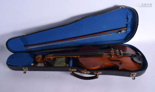 A CASED SINGLE PIECE BACK VIOLIN with bow, bearing label to ...