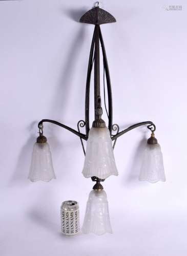A STYLISH MID CENTURY CHANDELIER with four period glass shad...
