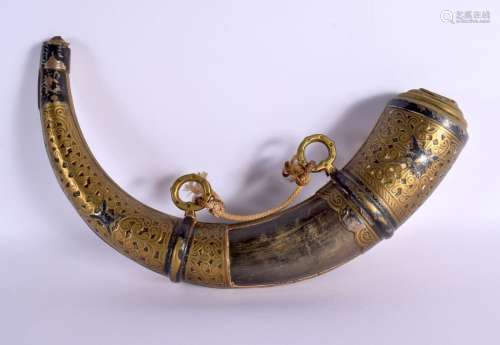 AN ANTIQUE MIDDLE EASTERN BRASS OVERLAID CARVED POWDER HORN....