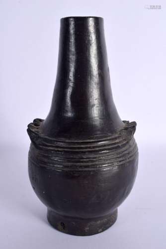 AN UNUSUAL EARLY SOUTH AMERICAN BLACK POTTERY VESSEL. 18.5 c...