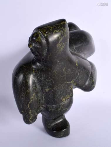 A CHARMING NORTH AMERICAN INUIT CARVED STONE FIGURE OF A MAL...