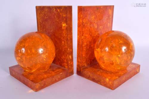 A RARE PAIR OF 1950S CRUSHED AMBER SPHERICAL BALL BOOK ENDS....
