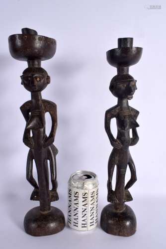 A PAIR OF EARLY 20TH CENTURY YAO TRIBE FIGURAL CANDLESTICKS ...
