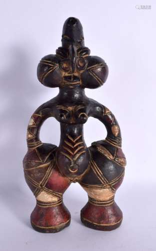 AN UNUSUAL EARLY 20TH CENTURY AFRICAN CARVED AND PAINTED TER...