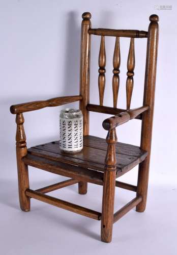 AN EARLY 19TH CENTURY ENGLISH CARVED WOOD CHILDS CHAIR of di...
