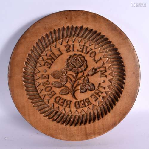 AN ANTIQUE CONTINENTAL CARVED WOOD BUTTER STAMP. 25 cm diame...