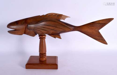 A VINTAGE PITCAIRN ISLANDS WOOD FIGURE OF A FLYING FISH. 30 ...
